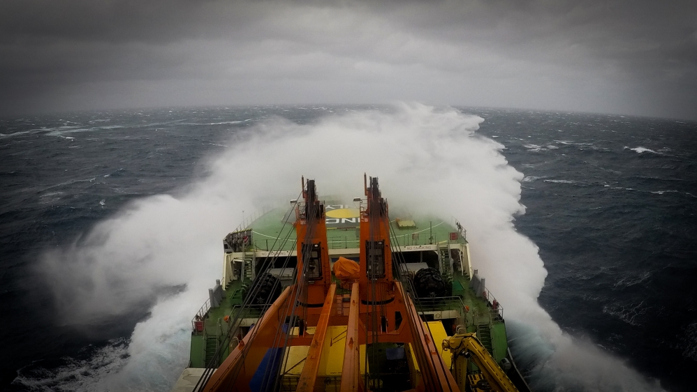 The great walls of water sweeping in from the west nudged and tipped the 12,000-tonne vessel [Tarek Bazley/Al Jazeera]