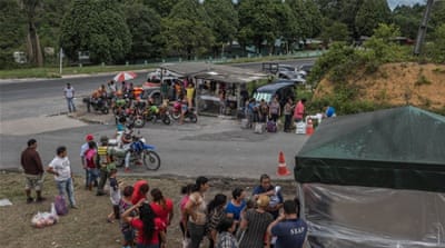 Relatives line up outside COMPAJ prison carrying essentials for the inmates, which should be provided by the state [Tomasso Protti/Al Jazeera]
