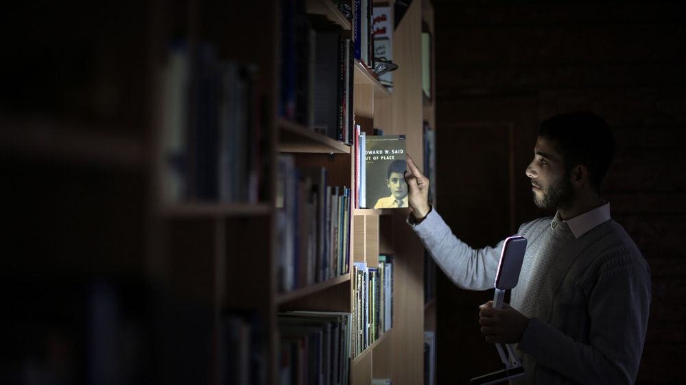 Abu Toha is determined to keep the books coming, noting that they serve as a vital lifeline to the outside world [Ezz Zanoun/Al Jazeera]