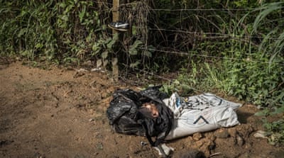 A motorcycle taxi driver found two black sacks by the side of the road. One contained a young man's head, the other his limbs and torso [Tomasso Protti/Al Jazeera]