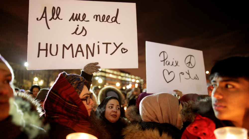 People attend a vigil in support of the Muslim community in Montreal