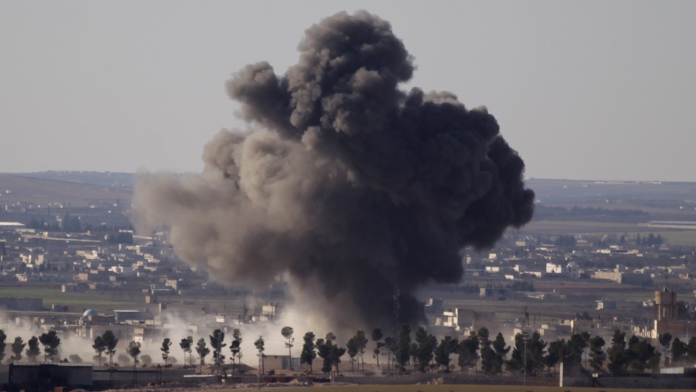 Smoke rises from the northern Syrian town of al-Bab