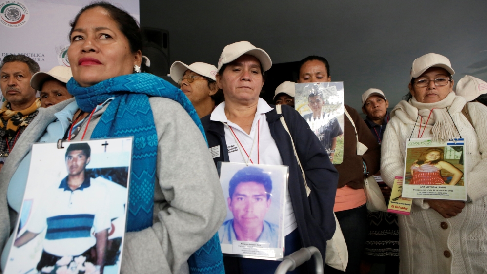 Caravan of Central American migrants'' mothers hold pictures of relatives in Mexico City