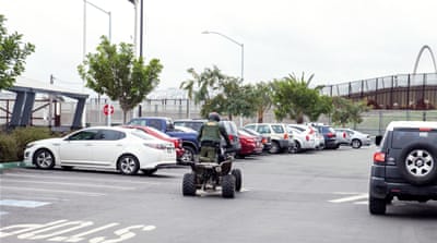A Customs and Border Patrol officer patrols the US side of the border with Mexico [Jessica Chou/Al Jazeera] 