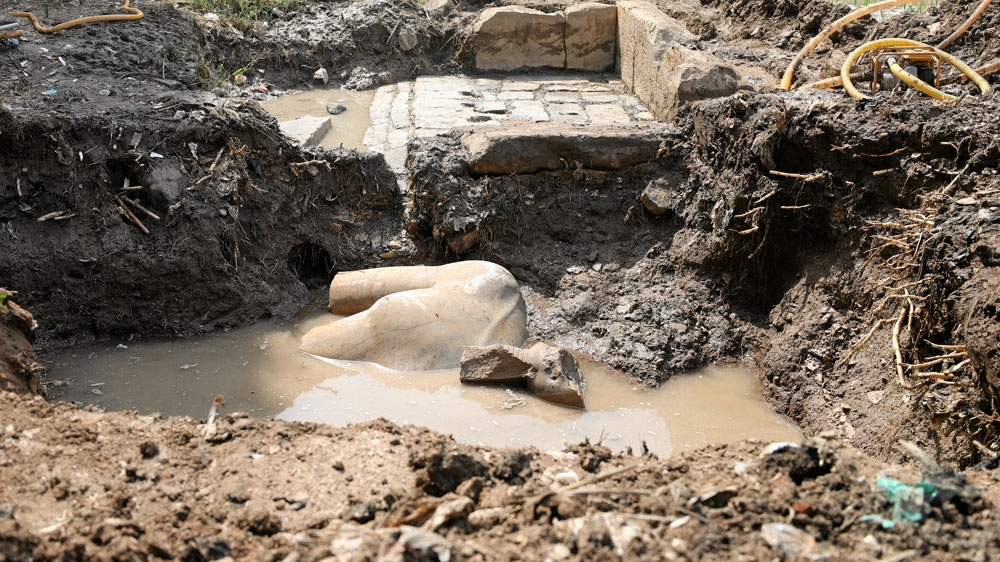 The two Pharaonic statues uncovered by archaeologists are believed to be more than 3,000 years old [Mohamed Abd al-Ghany/Reuters] 