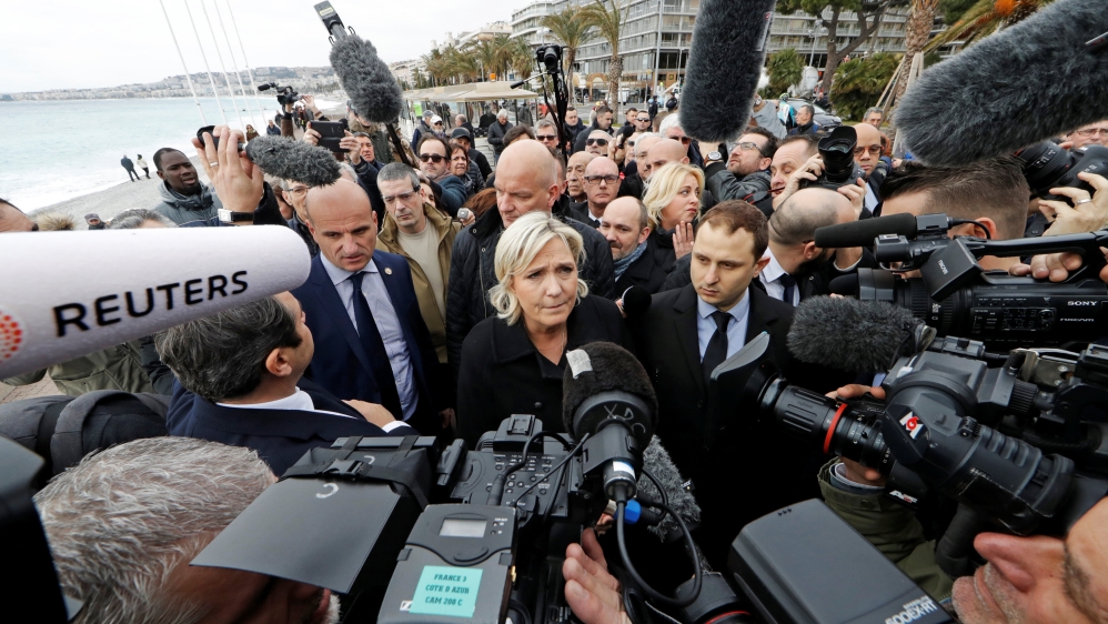 French National Front leader Marine Le Pen and presidential election candidate talks to the media on the Promenade des Anglais in Nice