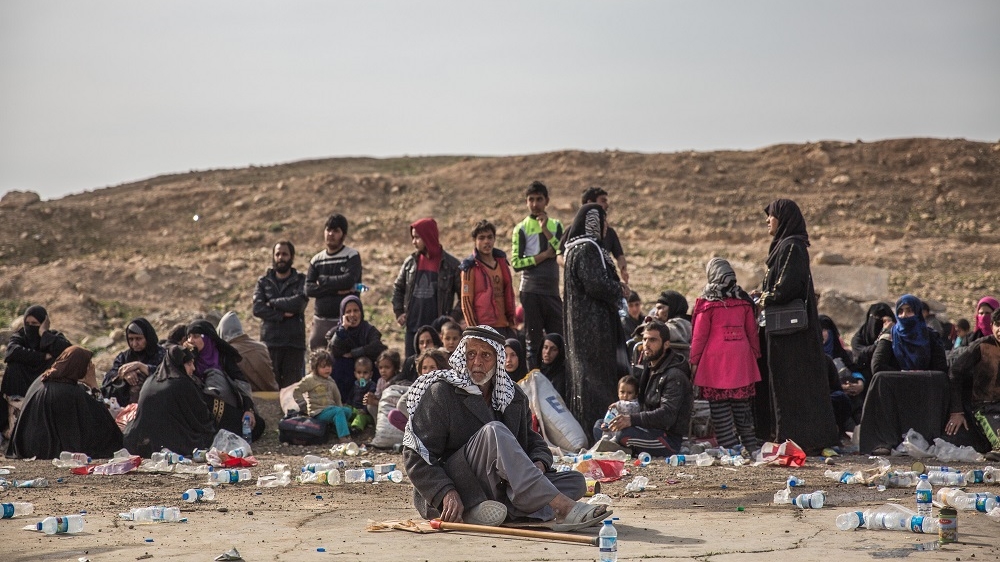 Exhausted, Tarik and his family arrived at a military checkpoint and medical clinic on raised ground to Mosul's southwest [John Beck/Al Jazeera]