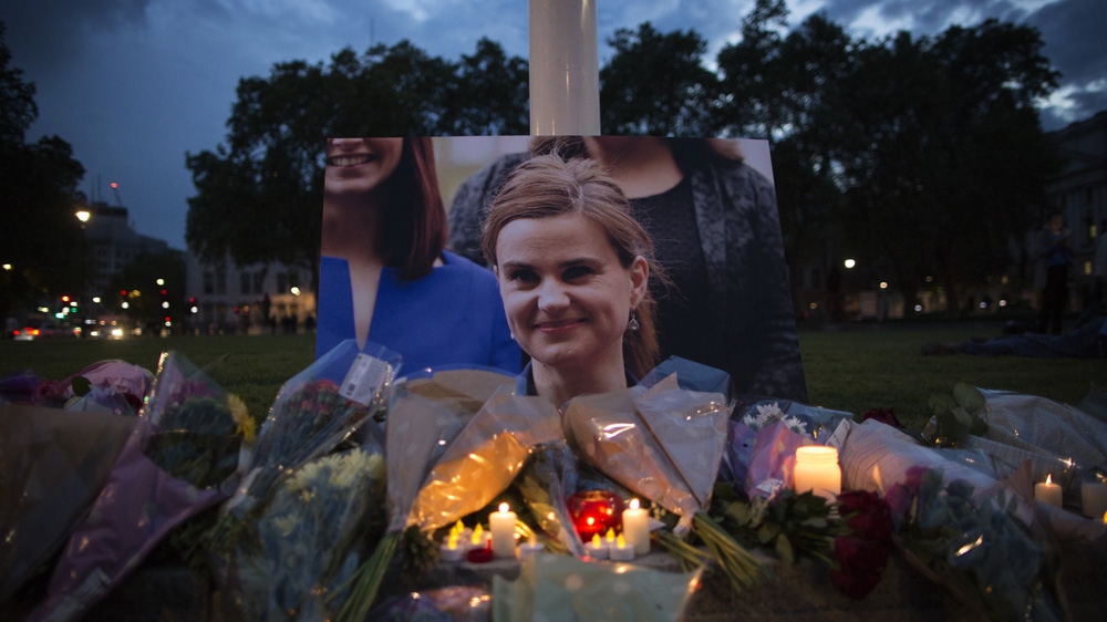 Flowers surround a picture of Jo Cox during a vigil in Parliament Square on June 16 [Dan Kitwood/Getty Images]