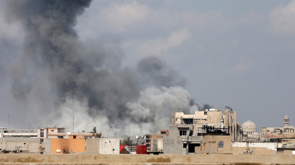 Smoke rises after an explosion as Iraqi forces battle with Islamic State militants in the city of Mosul