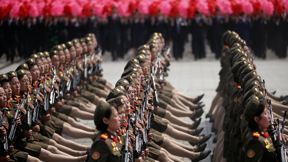 North Korean soldiers march and shout slogans during the military parade in Pyongyang [Damir Sagolj/Reuters]