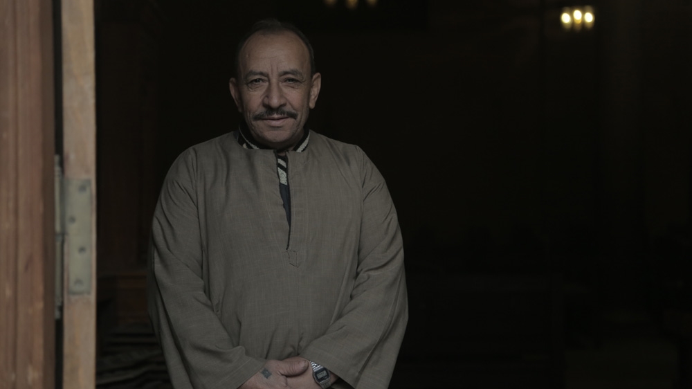 A worshipper at the Coptic churches in Old Cairo poses for a portrait. Roughly 10 percent of Egypt's population of 82 million are Christian [Dorian Geiger/Al Jazeera]