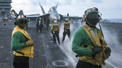 Sailors conduct flight operations on the aircraft carrier USS Carl Vinson [Matt Brown/US Navy via AP]