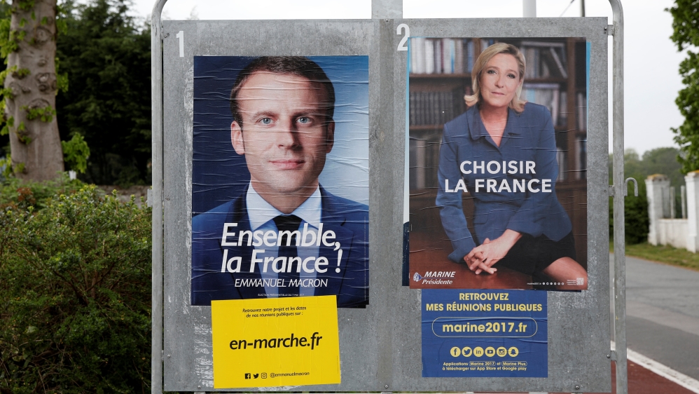 Emmanuel Macron leads Marine Le Pen 60 percent to 40 in the polls leading up to Sunday's vote [Benoit Tessier/Reuters]