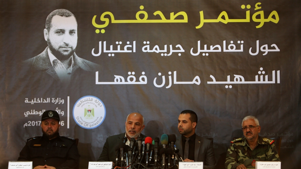 Tawfiq Abu Naeem (2nd L), head of Hamas-run security forces in Gaza, speaks during a news conference disclosing details on the killing of senior commander Mazen Fuqaha, in Gaza City