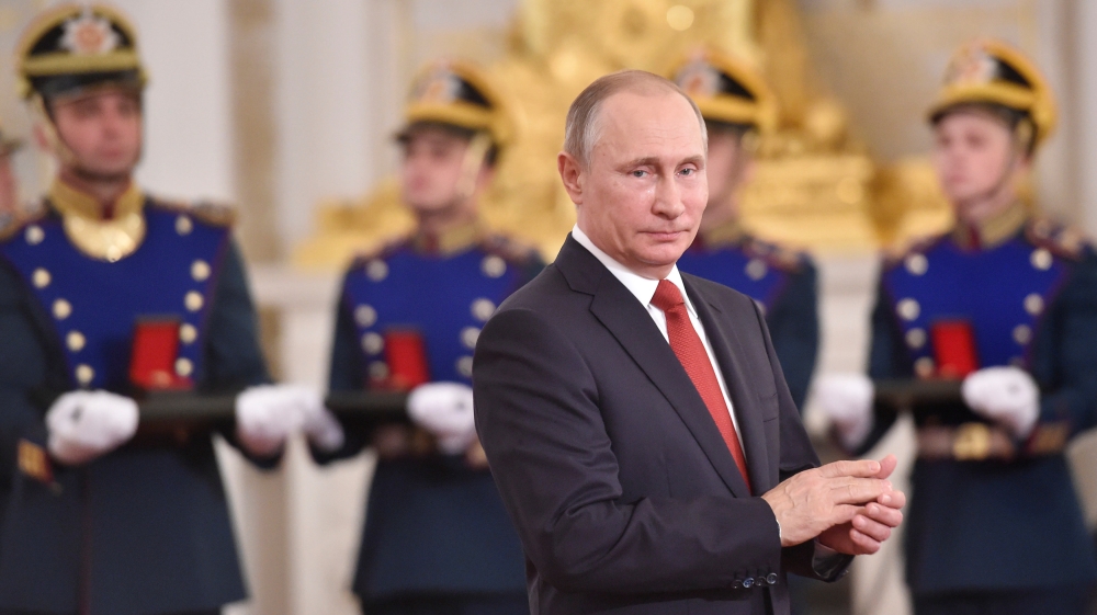 Russian President Putin applauds during the State Prize awards ceremony marking the Day of Russia at the Kremlin in Moscow