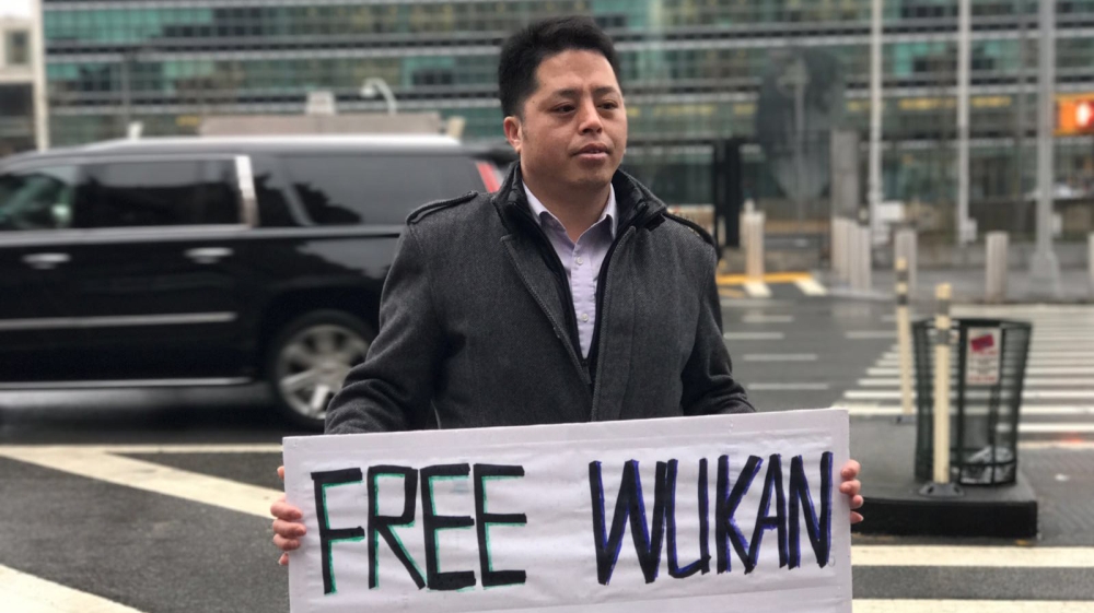 Zhuang Liehong at a protest in front of the United Nations building on February 7, 2017, in New York City [Lynn Lee/Al Jazeera]