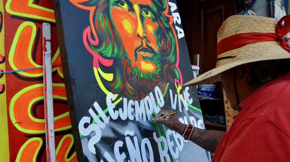 Local Callao artist Lucuma spent 30 years in Peruvian prisons before becoming a full-time artist [Paula Dupraz-Dobias/Al Jazeera]