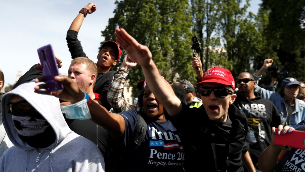 A pro-Trump supporter gives a Nazi salute in Berkeley during protests and skirmishes [File: Stephen Lam/Reuters]
