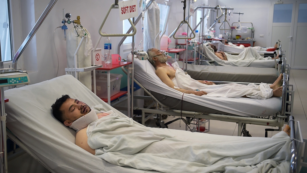 Injured Afghan men receive medical treatment