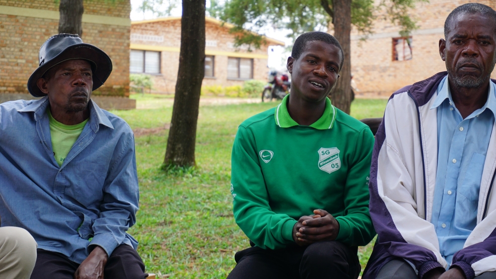 Evariste Shumbushuya, right, says contested narratives are the source of conflict between children in classrooms, which he hopes to ease through cooperative projects [Valerie Hopkins/Al Jazeera]