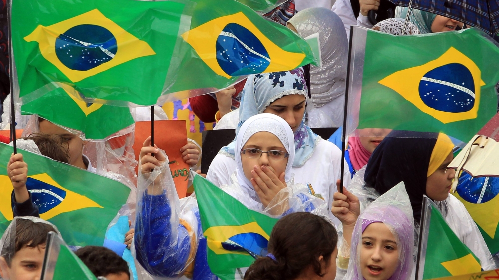 Muslim children protest against an anti-Islam film made in U.S. and cartoons mocking Prophet Mohammad published in a French magazine, in Sao Paulo