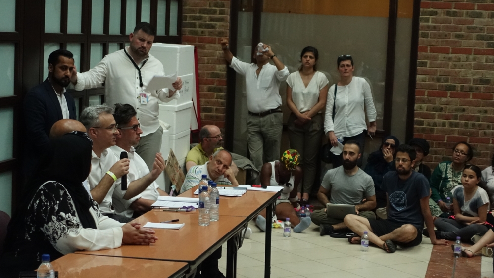 Lawyers and social housing advisors address surviving Grenfell Tower residents [Shafik Mandhai/Al Jazeera]