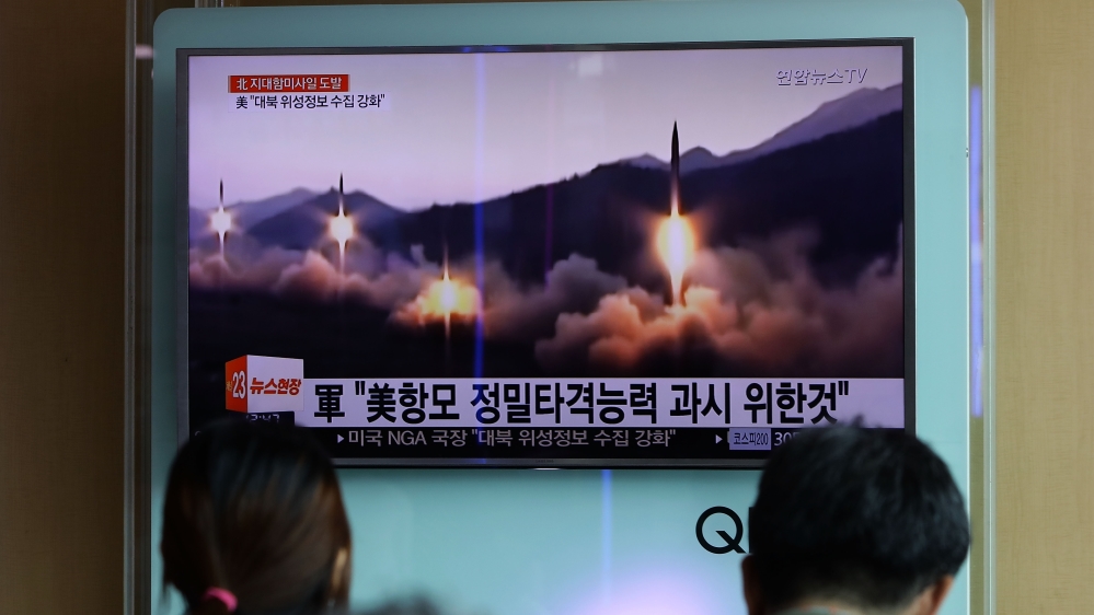 People in Seoul watch a broadcast about North Korea's fourth missile test in four weeks on June 8. Early this month, following Pyongyang's repeated missile tests, the UN Security Council expanded sanctions against North Korea [Chung Sung-jun/Getty Images]