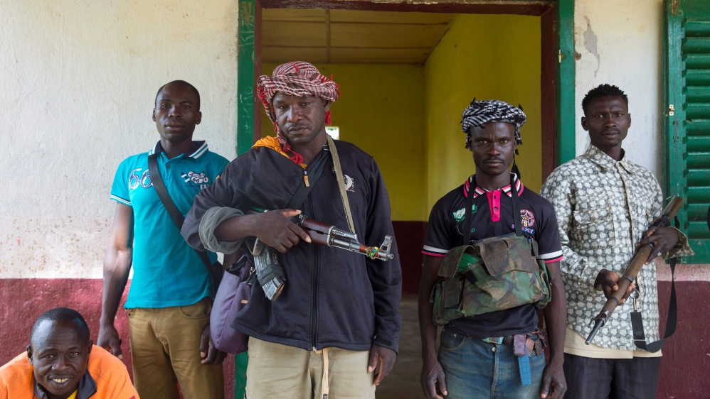 Members of the of the Anti-Balaka armed militia pose as they display their weapons in the town of Bocaranga, Central African Republic