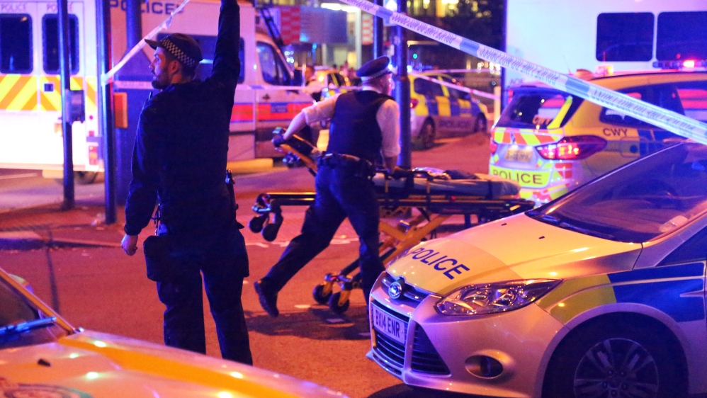 Police officers attend to the scene after a vehicle collided with pedestrians in the Finsbury Park neighbourhood of North London