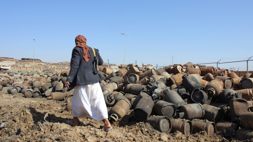 An armed Houthi man walks in Saada, Yemen