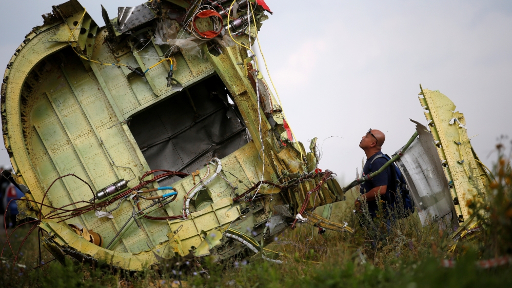 Malaysian air crash investigator inspects crash site of Malaysia Airlines Flight MH17 near Hrabove