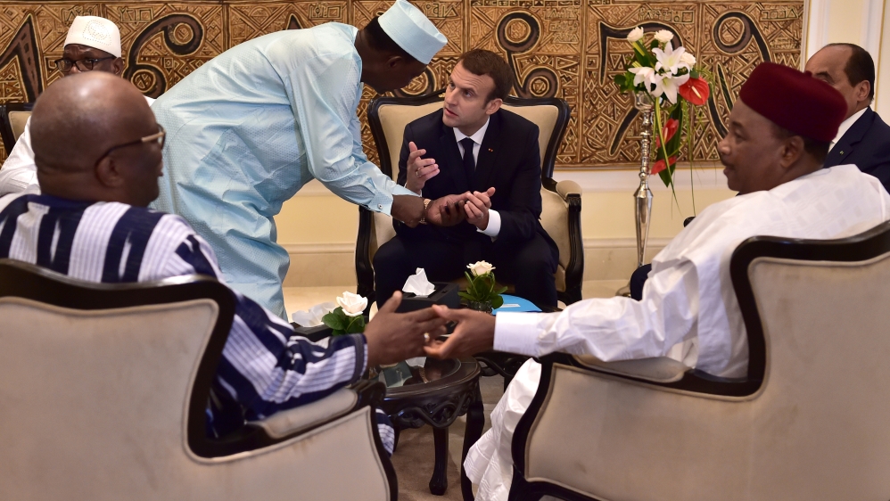 Chad''s president Idriss Deby Itno speaks with French President Emmanuel Macron during a G5 Sahel summit in Bamako