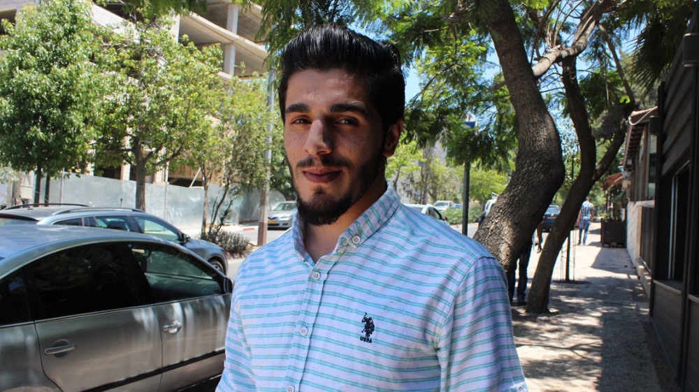 Palestinian social activist Nassar Jaradat was arrested and charged with two counts over his social media activity