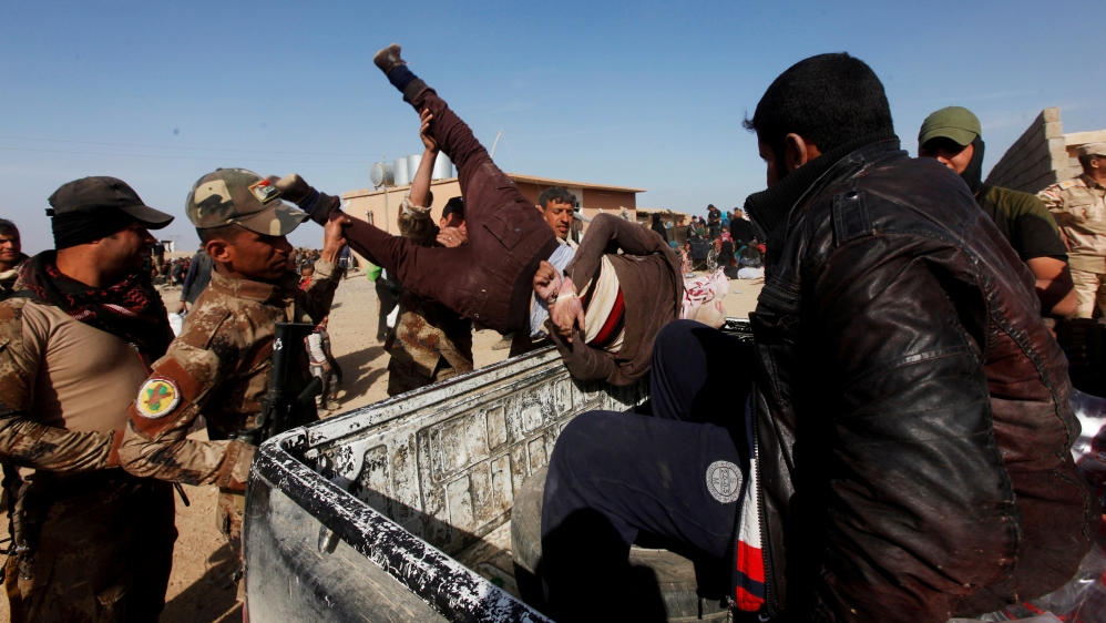 Iraqi forces arrest a person suspected of belonging to Islamic State militants in western Mosul, Iraq, February 26, 2017. [Reuters/Alaa Al-Marjani/]