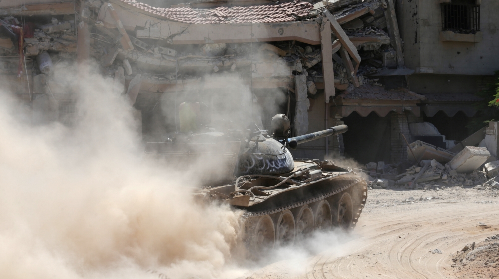 A tank belonging to special forces of the Libyan army enter the area of clashes with Islamist militants in their last stronghold in Benghazi