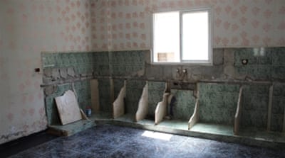 Fearing an imminent demolition of their home, the Abed family has stripped everything of value from the house, including the kitchen counters [Nigel Wilson/Al Jazeera]