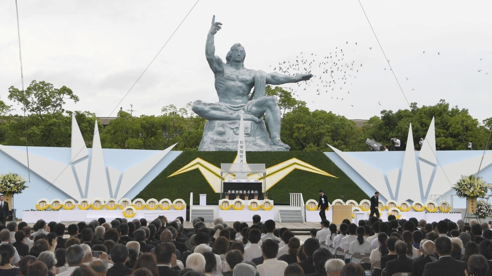 Doves fly over the Peace Statue in Nagasaki''s Peace Park during a ceremony commemorating the 72nd anniversary of the bombing of the city, in Nagasaki
