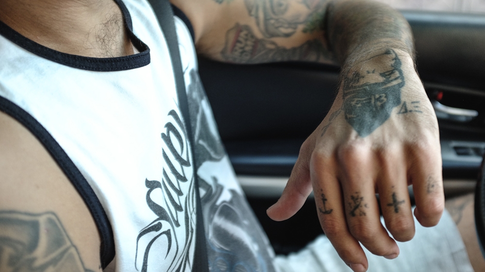 Athanasios shows a hand tattoo he got to remember Pavlos Fyssas, September 2017 [Nick Paleologos/SOOC/Al Jazeera]