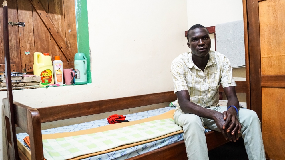 Dickens Omara was six when he was captured by the LRA, who blindfolded him and forced him to stab his father [Al Jazeera/Natalia Ojewska]