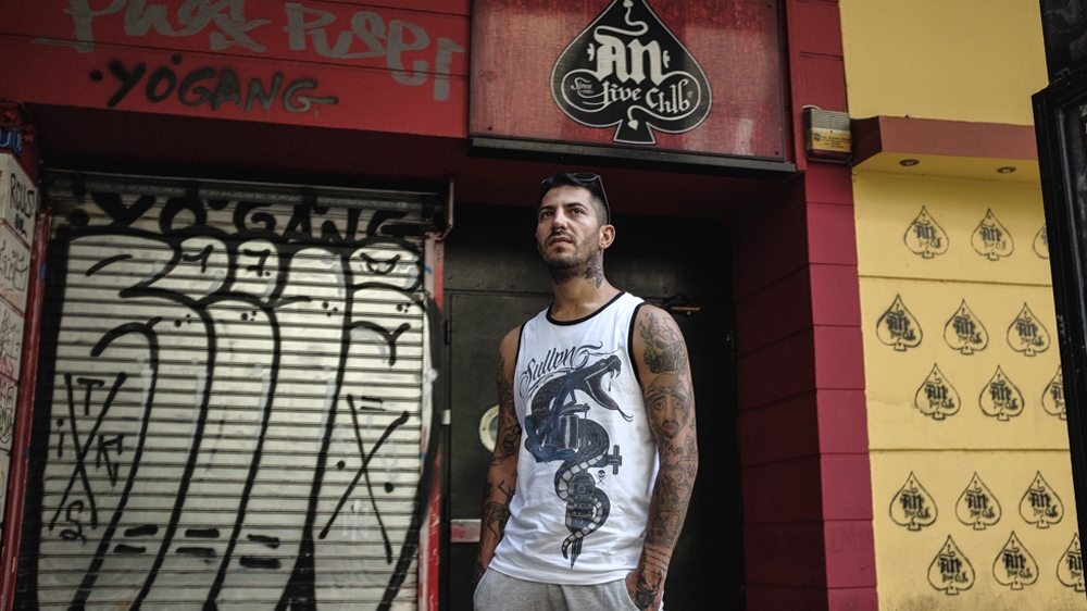 Athanasios Perrakis, known as Tiny Jackal, stands in the Exarchia neighbourhood of Athens in September 2017 [Nick Paleologos/SOOC/Al Jazeera]