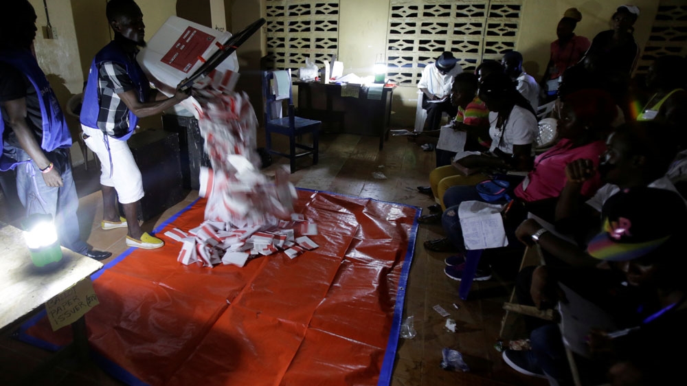 Once a winner is declared, it will represent the first democratic transition of power in more than seven decades [Thierry Gouegnon/Reuters] 