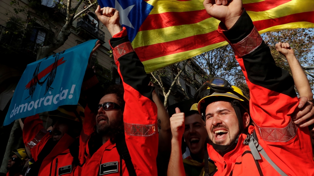 Catalan firefighters joined in on the celebrations. [Yves Herman/Reuters]