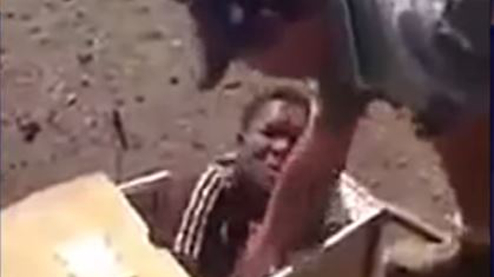 Oosthuizen and Jackson shoved Mlothshwa into a coffin in August 2016 [Screengrab/Al Jazeera]