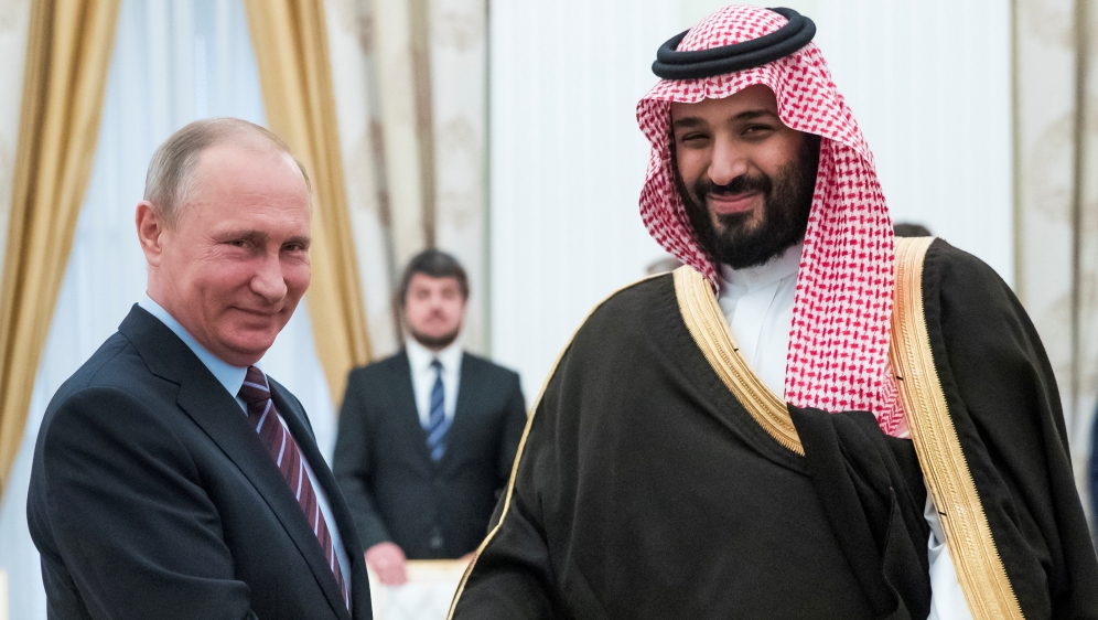 Russian President Putin shakes hands with Saudi Deputy Crown Prince and Defence Minister bin Salman during a meeting at the Kremlin in Moscow