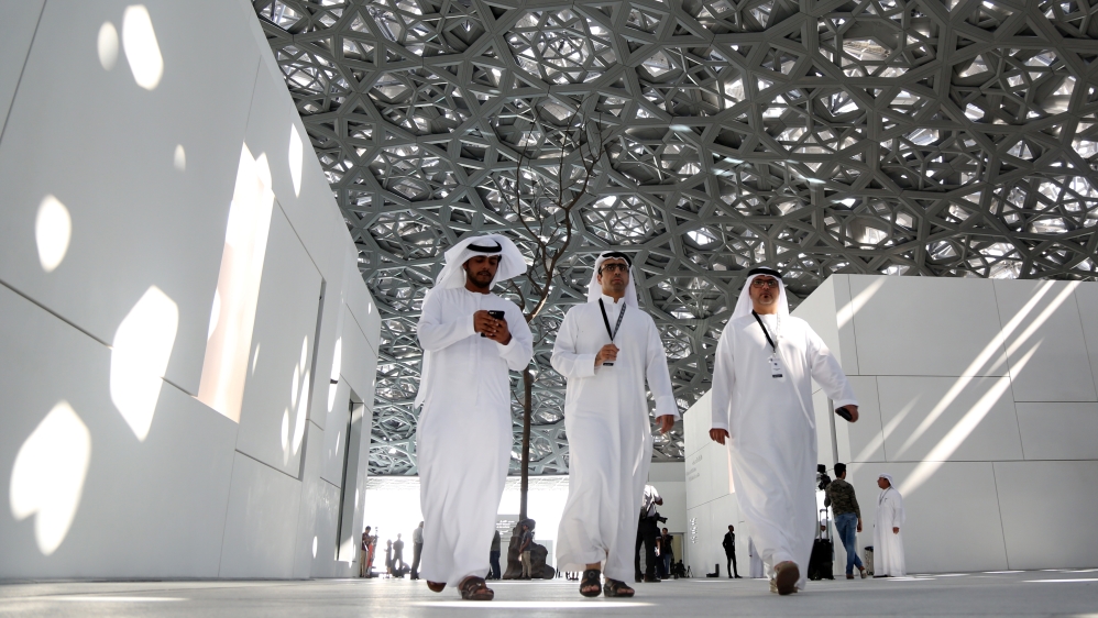 People walk at the Louvre Abu Dhabi in Abu Dhabi