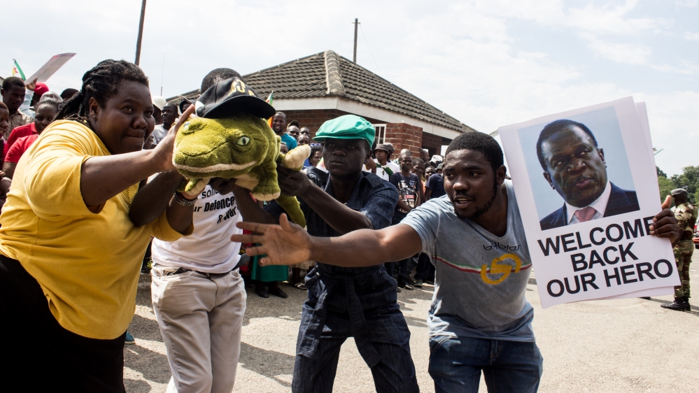 Mnangagwa supporters gathered at Manyame airbase on Wednesday to welcome him back from South Africa [Tendai Marima/Al Jazeera]