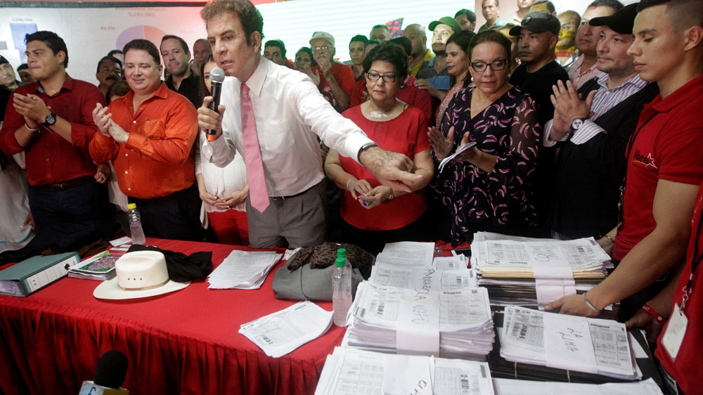 Nasralla shows the tallies of ballot counting during a news conference in Tegucigalpa, Honduras November 29, 2017 [Jorge Cabrera/Reuters]