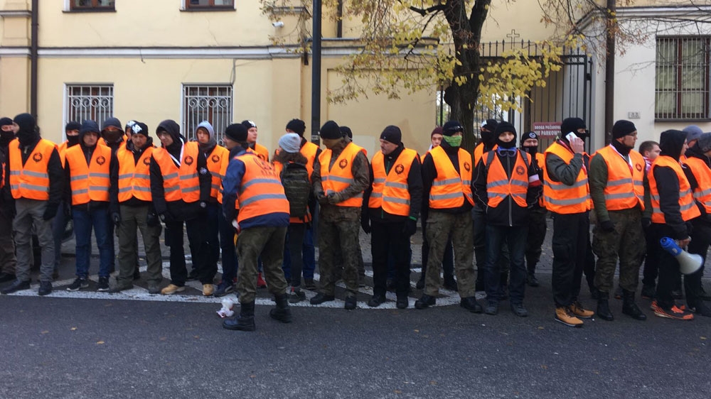 Since 2012, a group of sympathisers known as the march guard was recruited to provide security [Agnieszka Pikulicka-Wilczewska/Al Jazeera]