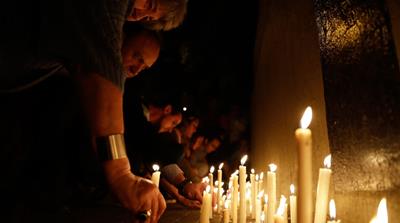  People place candles outside the Polytechnic School during a vigil in Rosario, Argentina [AP Photo] People place candles outside the Polytechnic School during a vigil in Rosario, Argentina [AP Photo] 