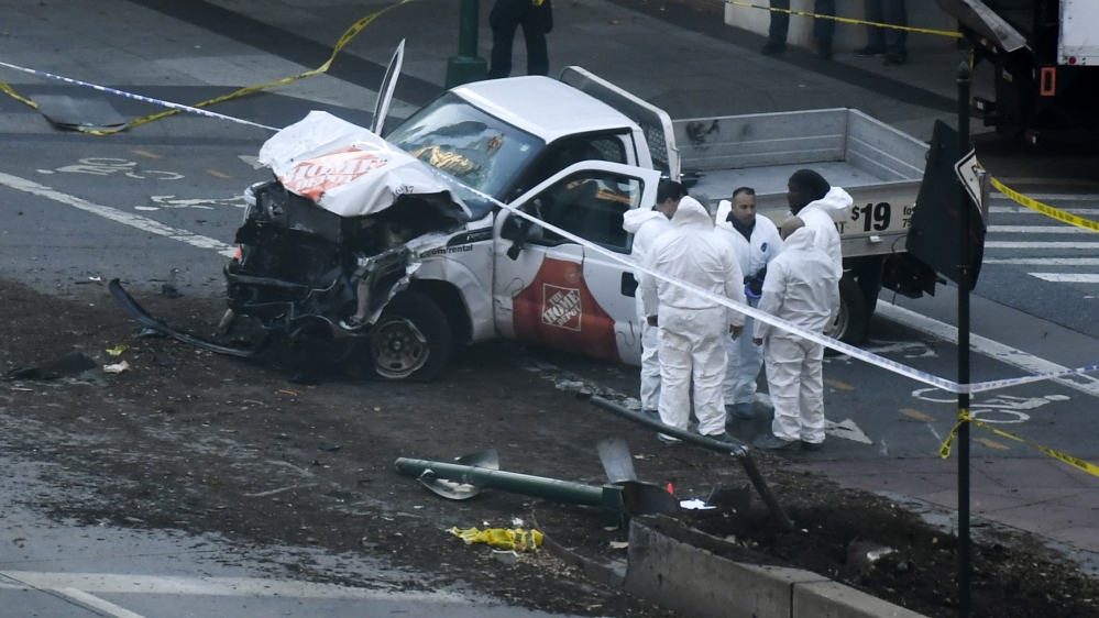 Investigators inspect the truck involved in Tuesday's New York City attack [Don Emmert/AFP]